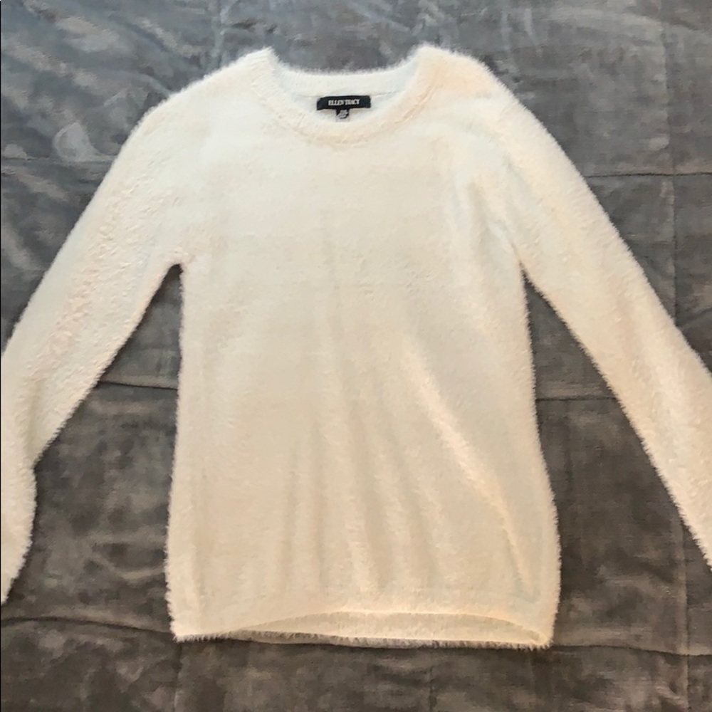 Light blue close to a white brand new sweater